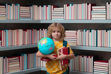 Fototapete - School boy world globe and books. Nerd school kid. Clever child from elementary school with book. Smart genius intelligence kid ready to learn. Hard study.