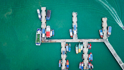 Wall Mural - aerial top down of pier in pattaya with tourist boarding the boat for visiting Ko Lan island gulf of Thailand 