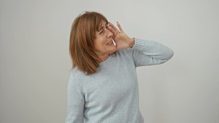 Canvas Print - Furious middle age woman in sweater, openly screaming, hand covering mouth. side view. isolated on white. ultimate stress meltdown!