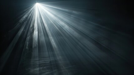 Wall Mural - Intense light beam isolated on a dark black backdrop, close-up view