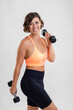 © JRP Studio - Fit caucasian woman with bob haircut posing in sport clothing lifting weights