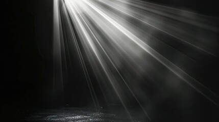 Wall Mural - Radiant beam of light shining in the blackness, close-up view