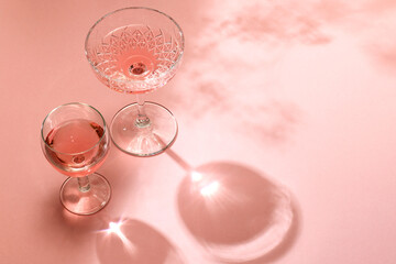 Wall Mural - various glasses on pink background