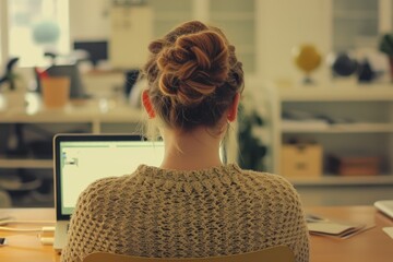 Wall Mural - Businesswoman Typing on Laptop in Modern Office