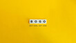 © photoopus - BOGO, Buy One, Get One Pricing Strategy. Text on Block Letter Tiles on Yellow Background.