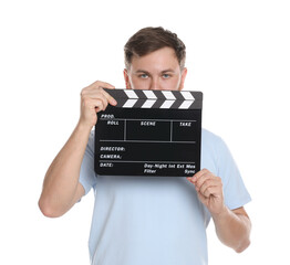 Poster - Making movie. Man with clapperboard on white background