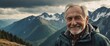 © sevenSkies - elderly caucasian guy in cloudy top of mountain sunny peak portrait smiling landscape background