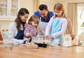 Wall Mural - Kitchen, baking and parents with kids in home with recipe for bonding, learning chef skills and fun together. Family, mom with dad and girls mix ingredients for cupcake, bake sale and breakfast