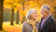 © Matthias - Elderly couple taking a romantic walk in the fall.