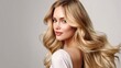 © Oranee  - A stunning blonde with long, loose waves cascading down her back.