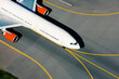 © Chalabala - Aerial view of airplane during taxiing to runway for take off. Traffic at airport on sunny day..