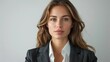 © Attasit - A woman in a sleek blazer, looking confident and ready for business against a white background