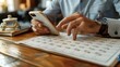 © DARIKA - Businessman using a cloud-based app to organize tasks, with a vintage desk calendar nearby, showcasing the shift from paper to digital planning tools realistic photo, high resolution , Minimalism,