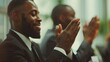 © LukaszDesign - Happy businesswoman clapping hands during a boardroom presentation with coworkers. A diverse gathering of executives clapping after an exciting and encouraging lecture on a panel.