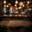 © Johannes - Wooden round table and pub or bar blur background Job ID: 8ac951dd-ea58-4bc4-988e-88f977d767d0