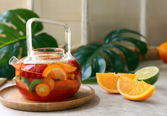 Canvas Print - citrus tea with fresh fruits and berries