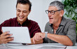 © TasJam/peopleimages.com - Man, employee and senior customer with tablet at office for life policy or insurance cover and retirement. People, boardroom and happy for digital file, document and contract for options and advice