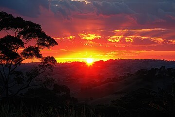 Wall Mural - A Fiery Sunset Over Rolling Hills