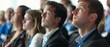 © Ai Studio - Attentive audience members, dressed in business attire, are engaged in an inspiring presentation at a professional conference.