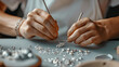 © Oranuch - Closeup of a jewelry maker at work, symbolizing fine arts