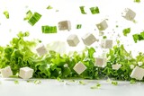 fresh lettuce leaves and feta cheese cubes suspended in mid-air Isolated on white background