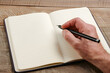 © Evan - Close-Up of Blank Notebook Being Written In at a Study Desk