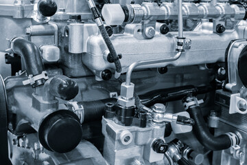 Aufkleber - A close up of a car diesel engine with many parts. The engine is made of metal and has a lot of parts