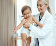 © KayJoint/peopleimages.com - Pediatrician, doctor and baby with consultation, smile and appointment for wellness, medicare and joyful. Professional, person and kid in office, healthcare and progress with examination and checkup