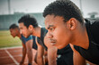 © DavisShared/peopleimages.com - Running, start and group of men on fitness track at arena for speed challenge, marathon event or sports exercise. Ready, set and people at stadium for competition, confident athlete and distance race