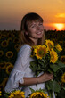© Олег Мальшаков - Beautiful young girl in a white dress in sunflowers