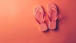 © Artyom - Pink flip-flops on coral background