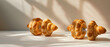 © LK  - A dumbbell of dough with a golden brown crust that follows the shape of the tall disks, but with the texture of a freshly baked croissant.