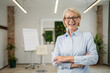© Miljan Živković - Portrait of one mature blonde caucasian woman with eyeglasses indoor