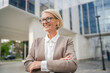© Miljan Živković - Portrait of one caucasian blonde mature businesswoman stand outdoor