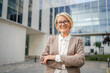 © Miljan Živković - Portrait of one caucasian blonde mature businesswoman stand outdoor