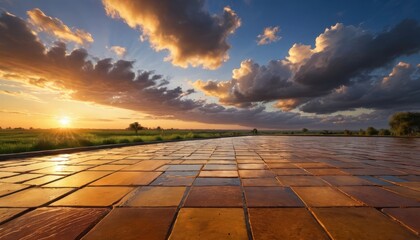 Poster - Sunset over a field with a stone path in the foreground.