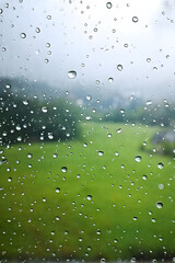 Wall Mural - spring background with rain drops on the window. natural texture concept