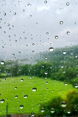 Wall Mural - spring background with rain drops on the window. natural texture concept