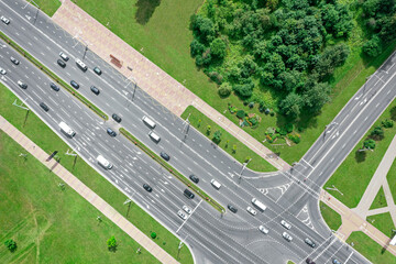 Wall Mural - road intersection during rush hour with traffic on road. aerial top view.