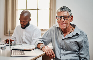 Mature man, portrait and meeting with laptop for campaign, senior citizenship or management at office. Male person, CEO or executive with smile or colleague on computer for elderly wellness program
