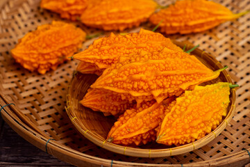 Wall Mural - Ripe bitter melon placed on a bamboo tray