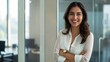 © Johannes - Hispanic smiling toothy Latino Indian successful confident Arabian businesswoman worker lady boss female leader girl business woman posing crossed hands looking at camera in office corporate portrait