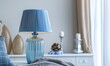 © Salander Studio - trendy living room interior design with a blue table lamp
