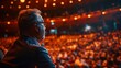 © Budi - CEO giving a speech at a company event in a large auditorium