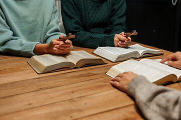 Wall Mural - A person reads the Bible, embodying faith and spirituality. The scene reflects a serene moment of contemplation and devotion, highlighting the importance of religion in everyday life.