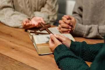 A person reads the Bible, embodying faith and spirituality. The scene reflects a serene moment of contemplation and devotion, highlighting the importance of religion in everyday life.