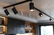 © Yi - Close-Up of Black Track Lighting System in Modern Home Interior Design