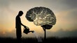 © Skoles - Concept: growth of mind and knowledge, creativity and improvement, intelligence and education. Silhouette of a man watering a tree in the shape of a human brain.