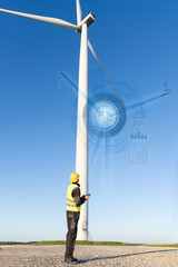 Aufkleber - Engineer with digital tablet controls wind turbines
