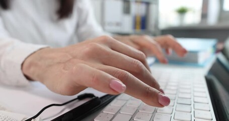 Female office worker typing on keyboard. Working as programmer or searching for information on Internet concept
